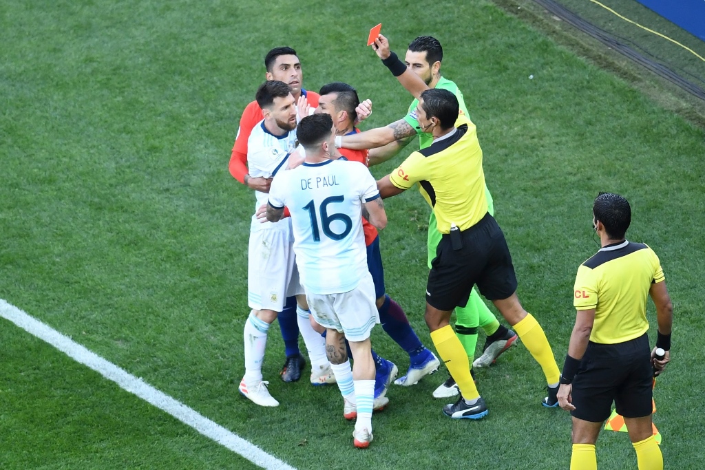 harsh decision messi was involved in a tangle with chile captain medel during the third place match and both players were given their marching orders by referee mario diaz de vivar photo afp