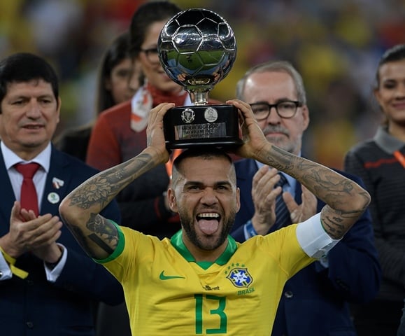brazil 039 s dani alves poses with his trophy for best player of the copa america after defeating peru in the final match of the football tournament at maracana stadium photo afp