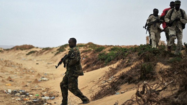 somali security forces patrol along the coast of qaw photo afp