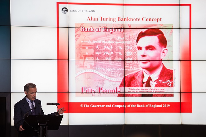 governor of bank of england speaks in front of concept design for fifty pound banknote featuring scientist alan turing photo afp