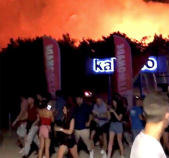 people walk following a fire during the fresh island festival in novalja croatia july 16 2019 in this still image taken from social media video photo reuters