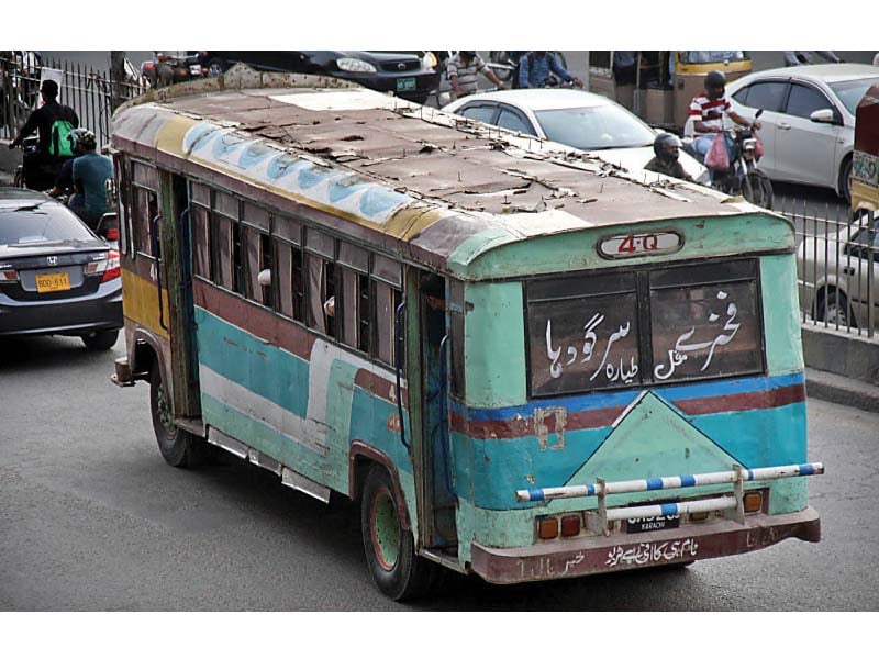 a local transport bus is seen on ma jinnah road carrying passengers manoeuvring through heavy traffic despite its tumbledown condition photo online