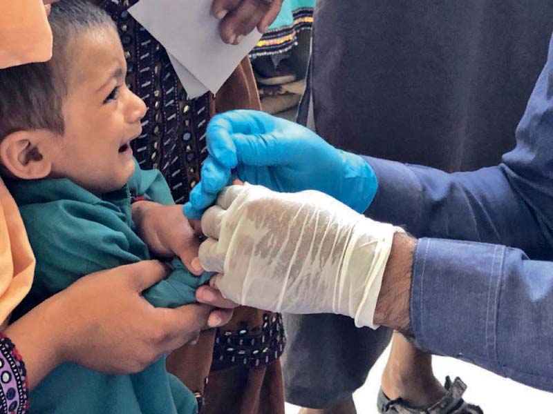 a child is tested for hiv using the alere strip at the rato dero taluka hospital thousands of people have been screened over the last month after cases of hiv surfaced among children photo file