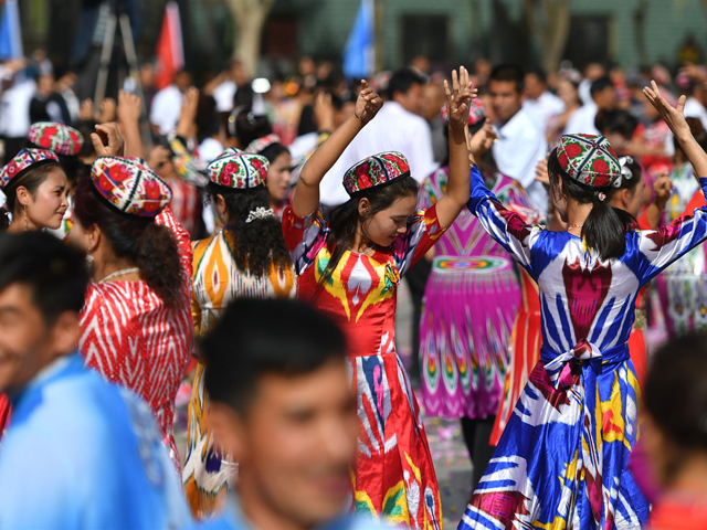 nearly 10 000 residents dance in local dolan maxrap folk style in awat county in the xinjiang uygur autonomous region on oct 9 2018 photo china news service