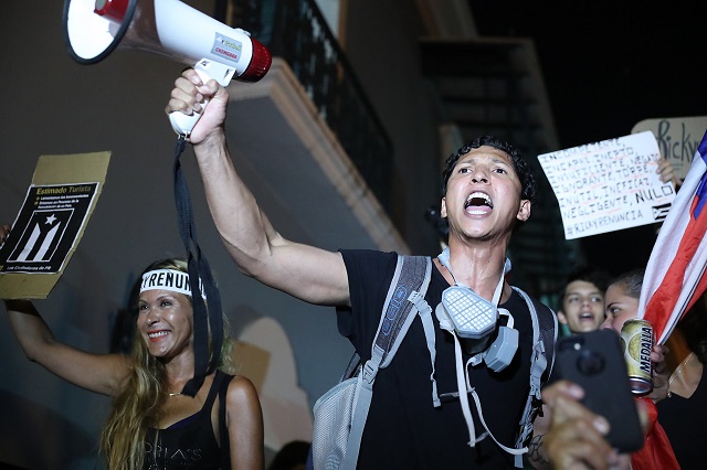 people react after hearing while demonstrating near the governor 039 s mansion reports that gov ricardo rossello will step down photo afp