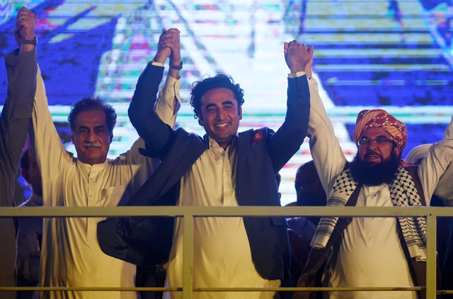 chairman of pakistan peoples party ppp bilawal bhutto zardari c join hands with other opposition parties leaders during an anti imran khan protest in karachi on july 25 2019 photo afp