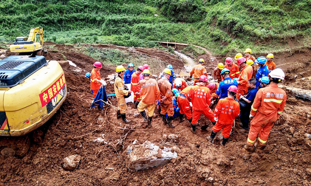 rescuers are working at the site of a landslide in liupanshui in china 039 s southwestern guizhou province photo afp