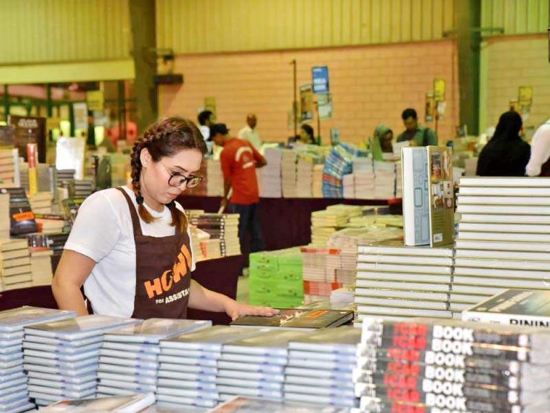 a visitor to the big bad wolf book sale at the expo centre looks at the merchandise on offer the event is said to be the biggest book sale in the world and has come to karachi for the first time photo press release