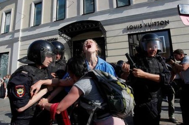 law enforcement officers detain protesters during a rally calling for opposition candidates to be registered for elections to moscow city duma the capital 039 s regional parliament in moscow russia photo reuters file