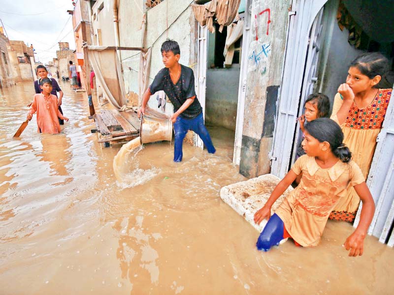 as the downpour continued in karachi for the second consecutive day the city remained on a standstill with citizens finding it difficult to carry out their routine chores photos inp