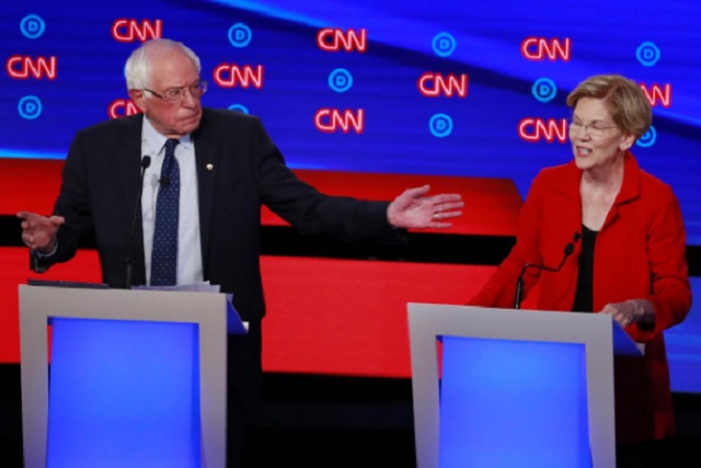 u s senator bernie sanders and u s senator elizabeth warren speak on the first night of the second 2020 democratic u s presidential debate in detroit michigan u s july 30 2019 photo reuters