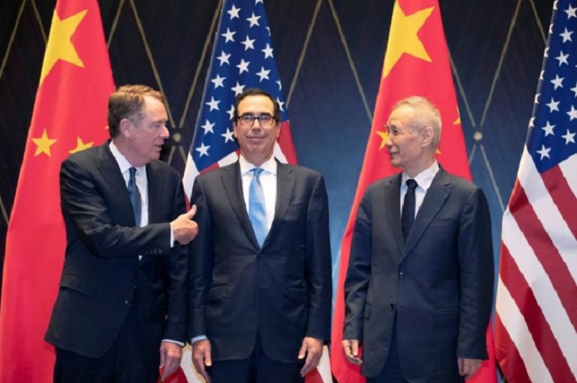 u s trade representative robert lighthizer gestures towards treasury secretary steven mnuchin as he chats with chinese vice premier liu he before they pose for a family photo at the xijiao conference center in shanghai china july 31 2019 photo reuters