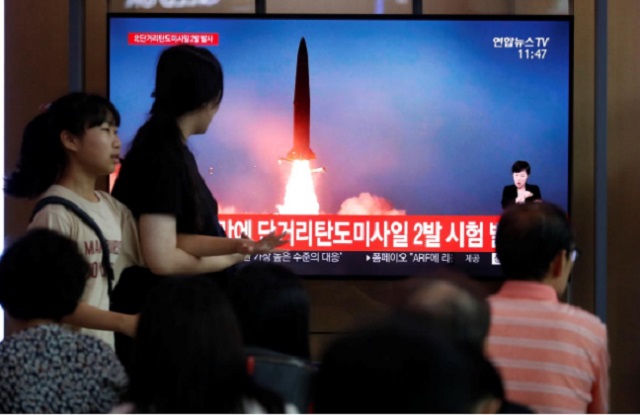 people watch a tv that shows a file picture of a north korean missile for a news report on north korea firing short range ballistic missiles in seoul south korea july 31 2019 photo reuters