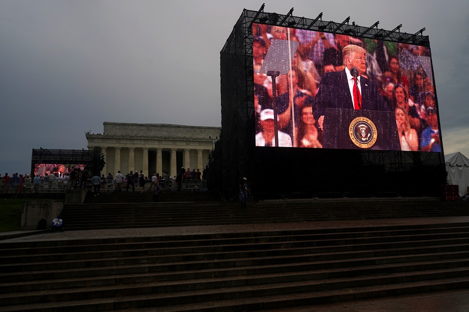 President Donald Trump appears on a large screen at the Lincoln Memorial Washington. :REUTERS