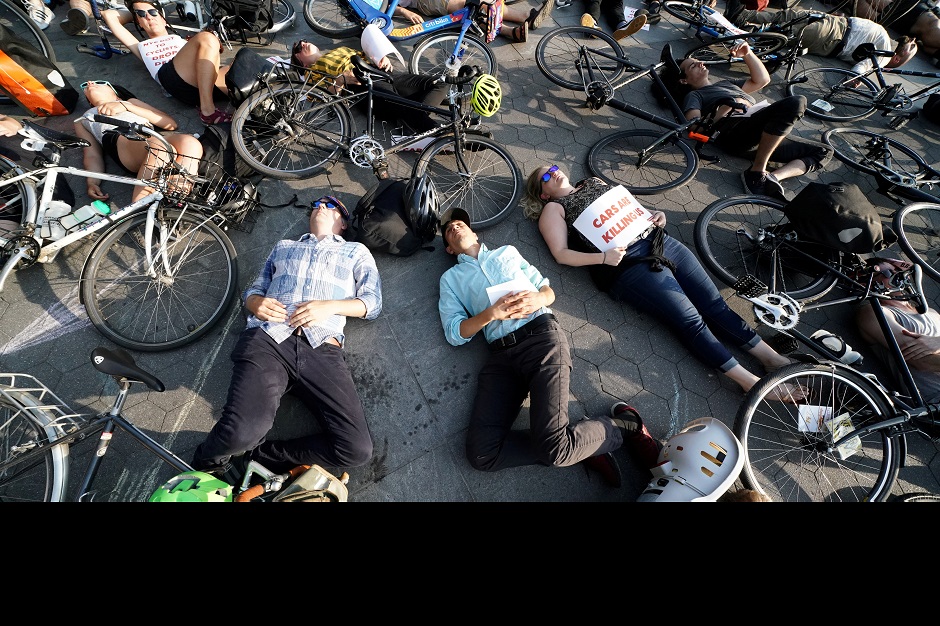 People take part in a 'Die In' protest to bring attention to cycling injuries and deaths while riding on roads, in the Manhattan borough of New York:REUTERS