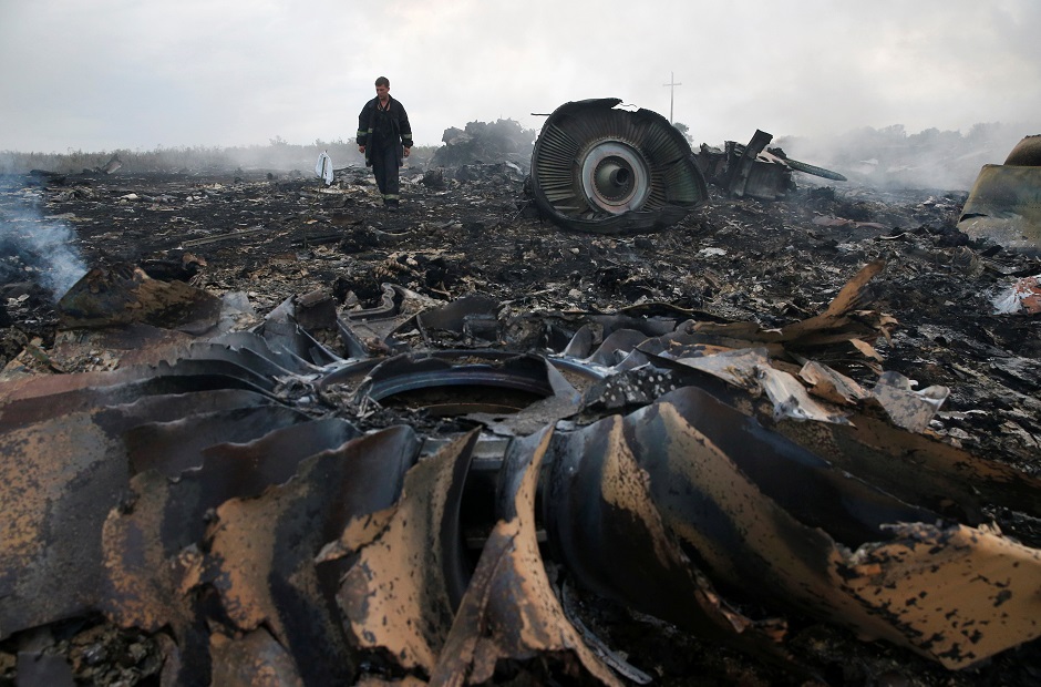 An Emergencies Ministry member walks at a site of a Malaysia Airlines Boeing 777 plane crash near the settlement of Grabovo in the Donetsk region:AFP