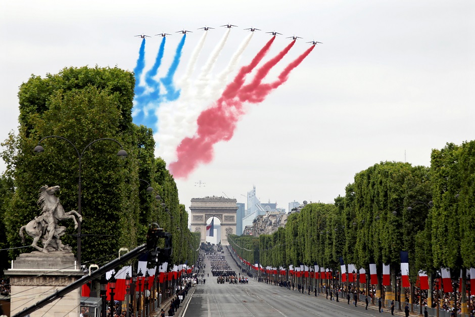 Alpha jets from the French Air Force Patrouille de France fly during the traditional Bastille Day : REUTERS