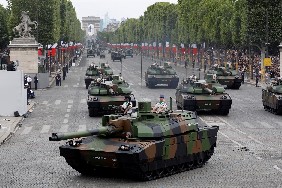 French armoured vehicles drive down the Champs-Elysees Avenue during the traditional Bastille Day military parade : REUTERS