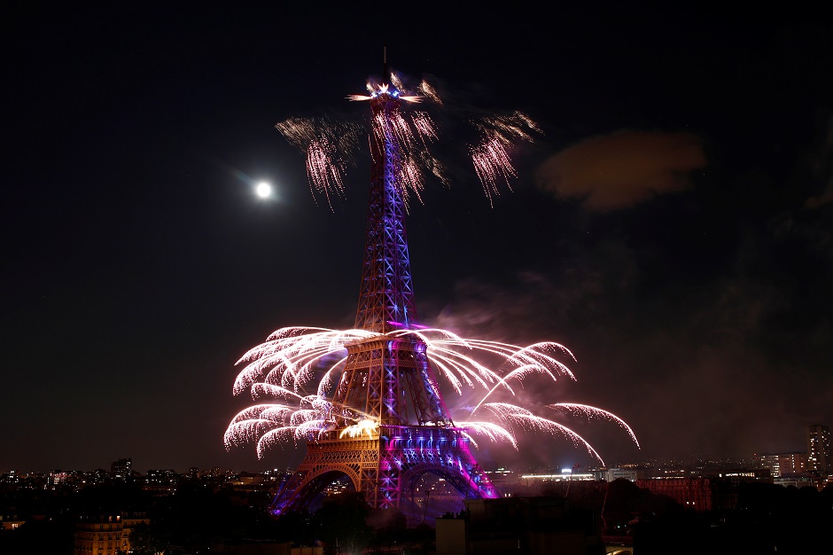 Fireworks explode in the sky above the Eiffel Tower, in a picture taken from the Shangri-La Hotel, Paris, at the end of Bastille Day: REUTERS