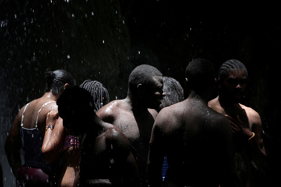 Haitians bathe during the celebration of the annual pilgrimage to the waterfall in Saut D'Eau, Haiti : REUTERS