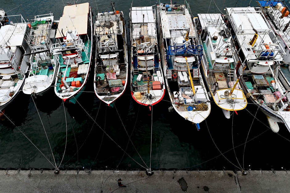 Fishing boats are pictured tied up at the harbour as a precaution in New Taipei City as Tropical Storm Danas approaches southeast Taiwan : AFP