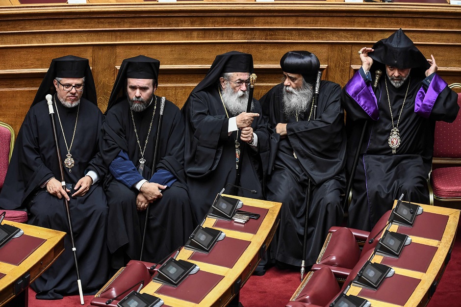 Priests from different religions attend a swearing in ceremony in the Greek parliament on July 17, 2019. - Greece's parliament was sworn in today after July 7 elections that saw a broad conservative victory end over four years of leftist rule. :AFP