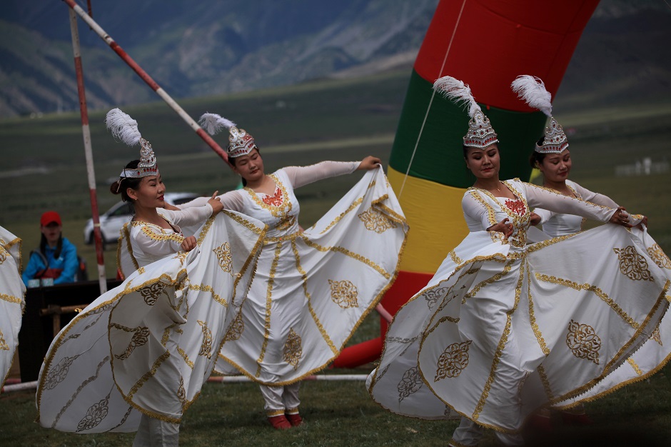 4.Women dressed in ethnic Kazakh costumes perform during a grassland festival in Bortala Mongol Autonomous Prefecture in China. PHOTO: Reuters.