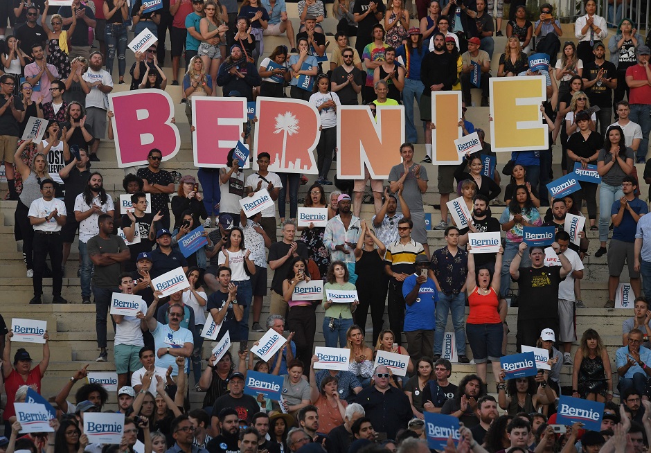 Supporters of 2020 Democratic presidential hopeful Vermont US Senator Bernie Sanders (not pictured) react during a campaign rally in Santa Monica, California. PHOTO: AFP
