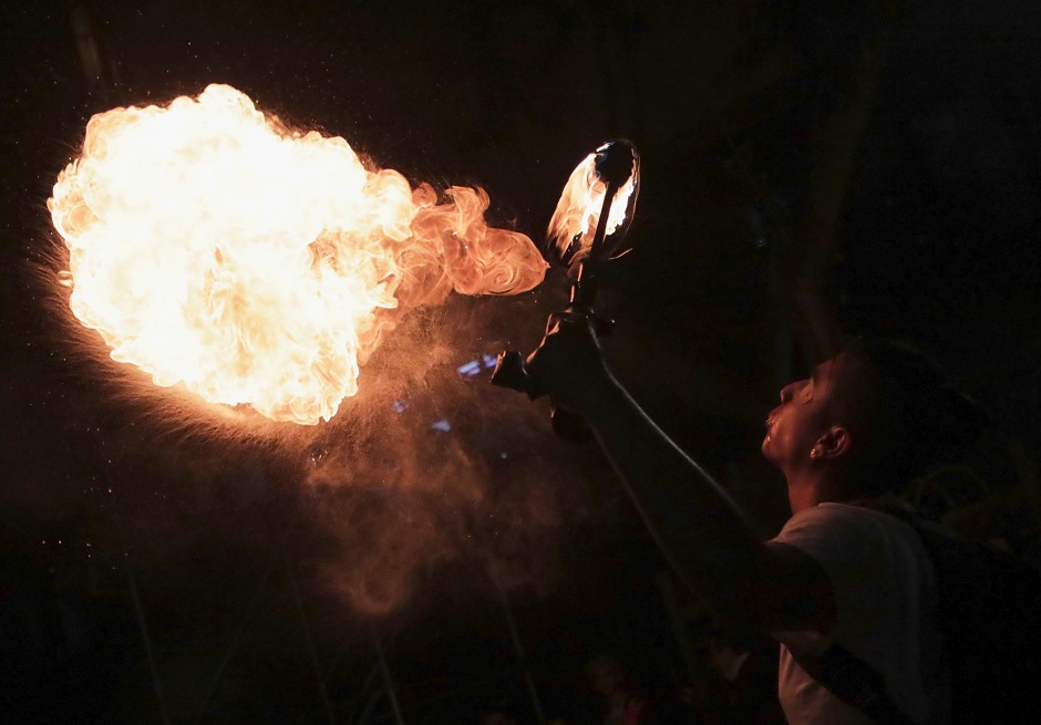 A fire-breathing performance takes part during a protest against the killing of social activists, in Bogota, Colombia July 26, 2019. PHOTO: Reuters