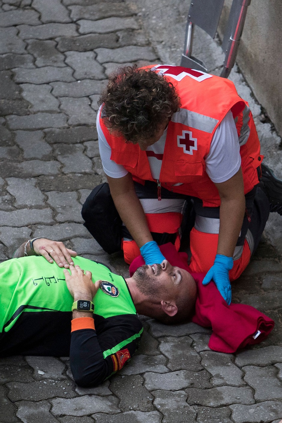 A paramedic attends to a man who was injured during the third bullrun. PHOTO: AFP.