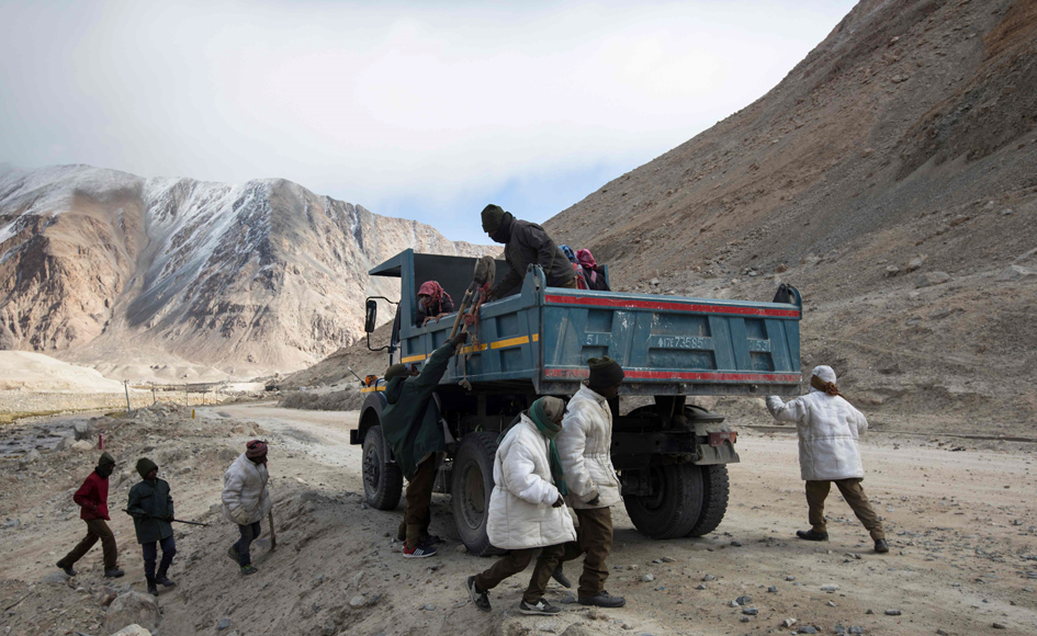 A group of labourers are toiling in a cold Indian Himalayan desert to repair some of the world's highest roads. Photo: AFP