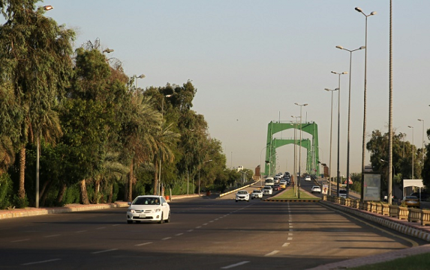 Iraqis drive in Baghdad's high-security Green Zone after all the main roads criss-crossing the enclave were opened last month. PHOTO: AFP