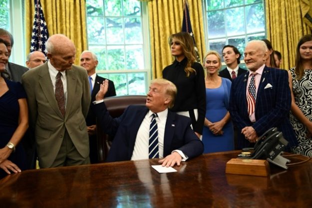 US President Donald Trump and First Lady Melania Trump host Apollo 11 crew members Michael Collins (L), Buzz Aldrin (R) and their families at the White House. PHOTO: AFP