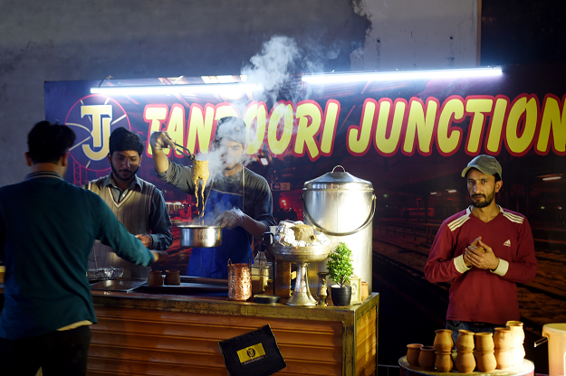 In this picture taken on March 29, 2019, a Pakistani workers prepares tandoori tea at a stall of a market in Islamabad. PHOTO: AFP