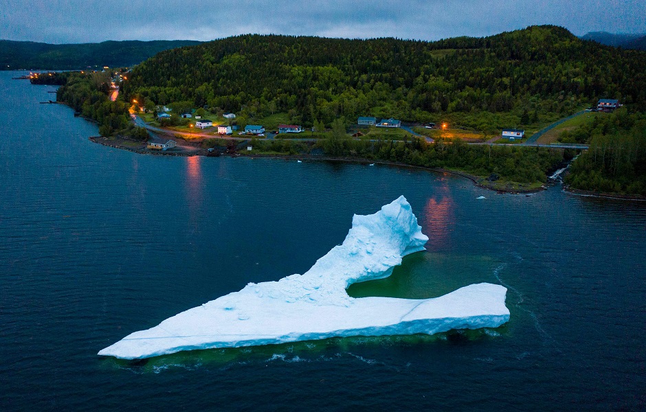 An iceberg floats at the seashore of King's Point. PHOTO: AFP