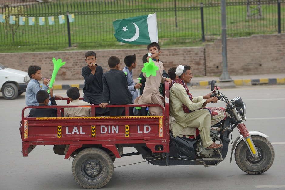 Youth gesture on a modified three wheel vehicle during 73rd Independence Day celebrations in Quetta. (Photo: Abdul Majeed / AFP)