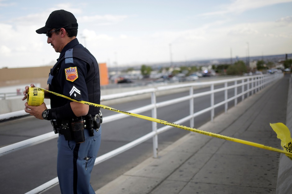 A police officer secures the area with a police cordon after a mass shooting at a Walmart in El Paso, Texas, US. PHOTO: Reuters