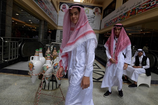 Amir Mohamed Khan (R), 14, and Chouaib Milne, 16, are pictured at a hotel in the in Saudi Arabia's holy city of Mecca, prior to the start of the annual Hajj pilgrimage in the holy city. (Photo: AFP)