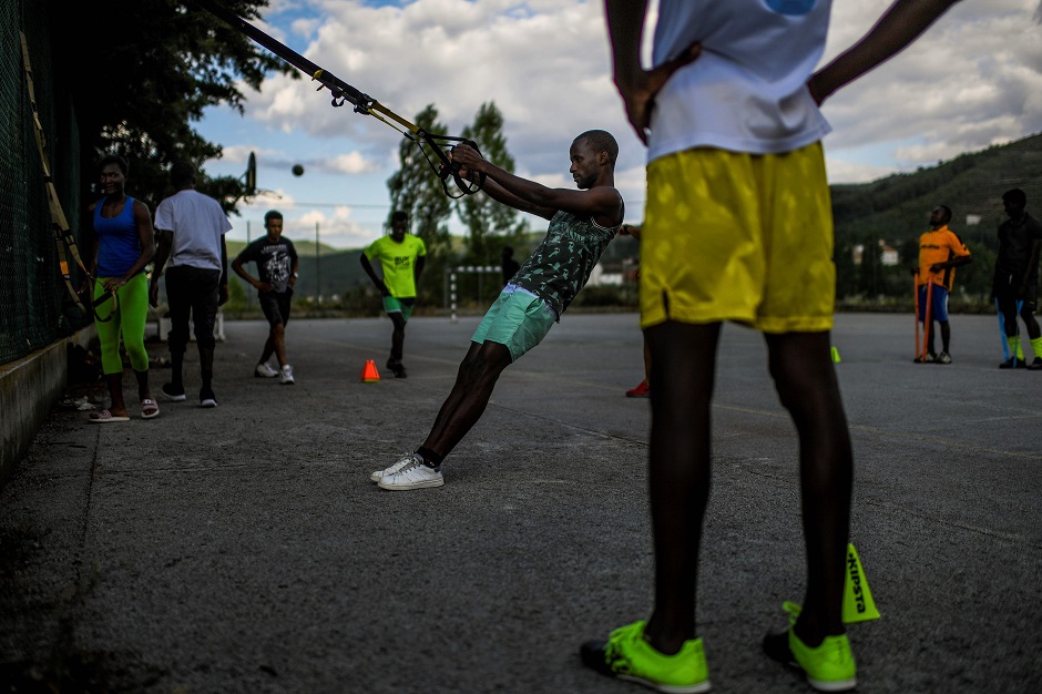Guinean refugee Mory Camara exercises during a sports class at Fundao migrant center in Fundao, central Portugal. PHOTO: AFP
