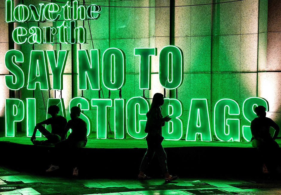This photograph shows a publicity sign promoting a plastic bag-free shopping experience outside a department store in downtown Bangkok. PHOTO: AFP