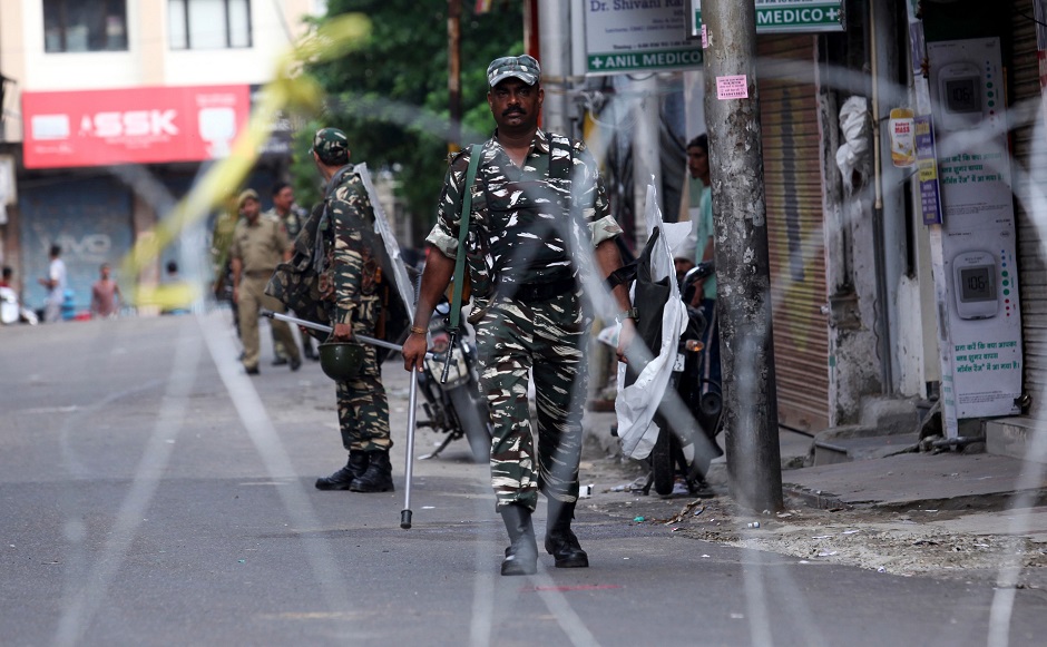 Security personnel patrol along a street in Jammu on August 6, 2019. (Photo: Rakesh BAKSHI / AFP)