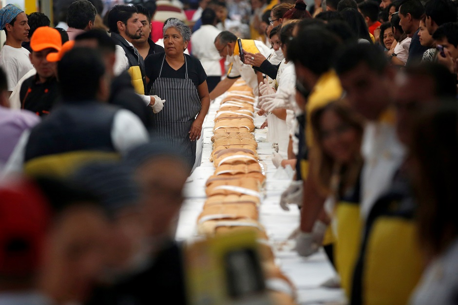 A 72-meter long 'torta', or sandwich, is prepared as an attempt to break the record for the world's biggest sandwich, in Mexico City. PHOTO: Reuters