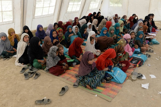 Afghan schoolchildren study at the destroyed Papen High School in Deh Bala district of Nangarhar province.  Photo: AFP