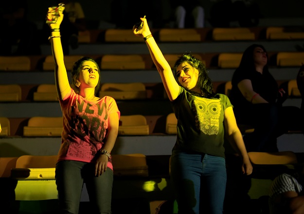 Young women dancing in the concert in Baghdad. PHOTO: REUTERS 