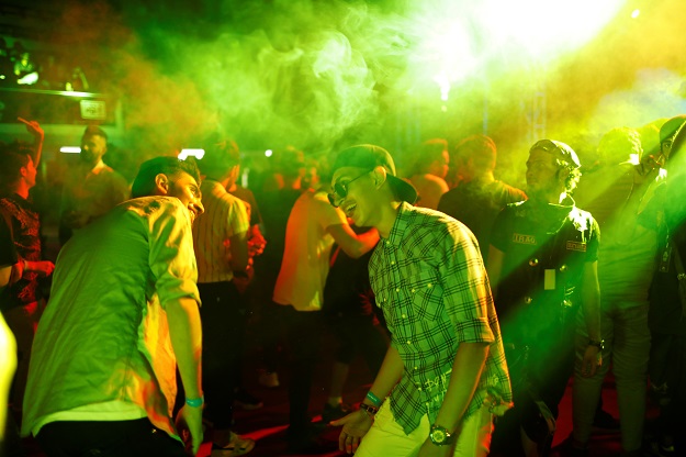 Young people dance as they attend electronic music concert with western tunes at closed Hall in Shaab Stadium for the first time in Baghdad. PHOTO: REUTERS