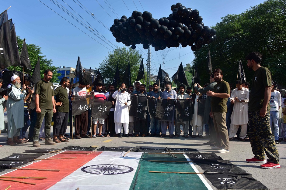 Activists of Hizbul Mujahideen (HM), a Kashmiri separatist group, releases black balloons during a protest in Muzaffarabad, the capital of Pakistan-controlled Kashmir. PHOTO: AFP