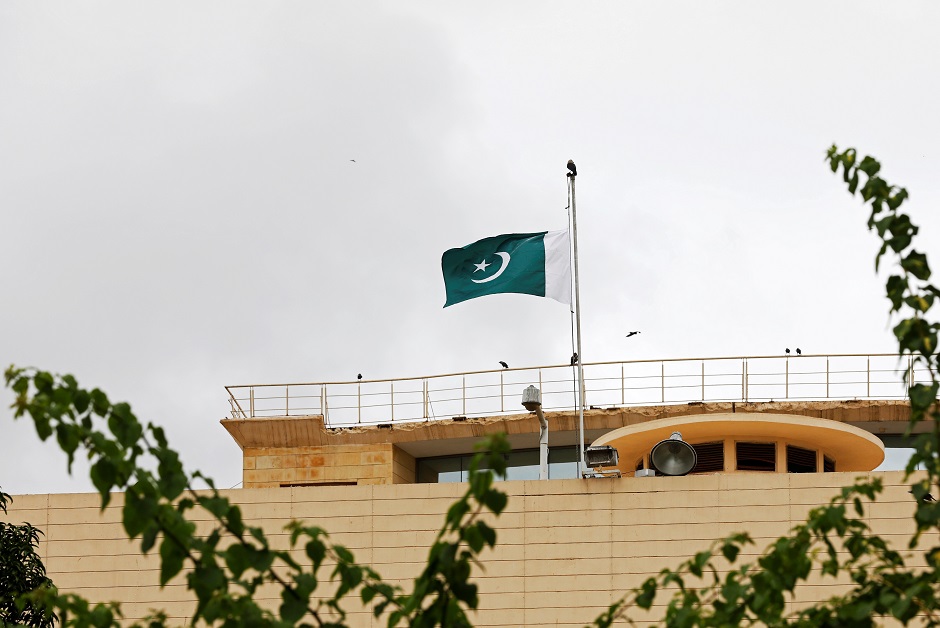 Pakistan's flag flies at half-mast to observe Black Day over India's decision to revoke the special status of Jammu and Kashmir, above the Provincial Assembly of Sindh building in Karachi. PHOTO: Reuters