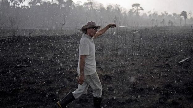 A Brazilian farmer walks through a burnt area of the Amazon in Rondonia state. (PHOTO: AFP)