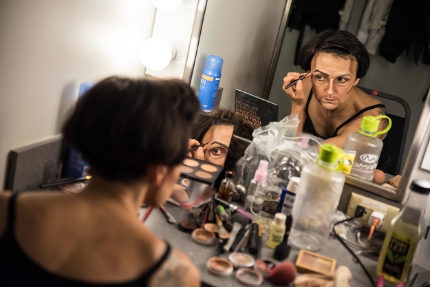 : In this file photo taken on July 12, 2019 Melodie Rousseau applies makeup for her Drag King performance in Montreal, Canada. PHOTO: AFP