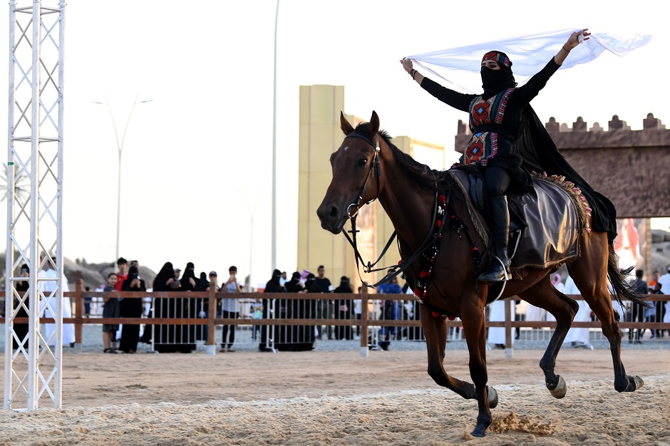 A Saudi woman rides a horse during the Souk Okaz Festival in the Saudi city of Taif. PHOTO: AFP